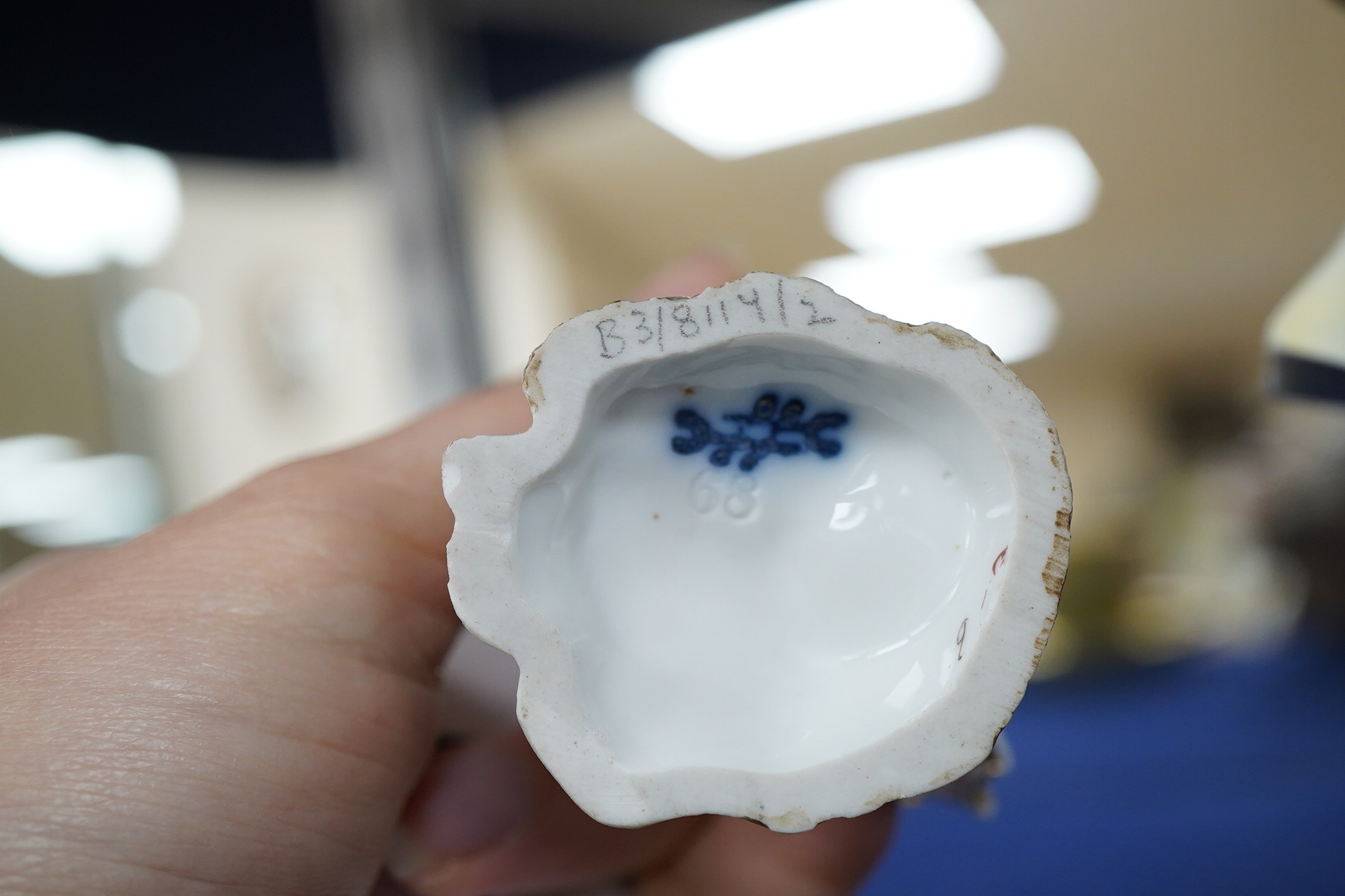 An early 20th century Coalport jewelled cabinet cup and saucer, a Karl Ens grop and a Plane figure